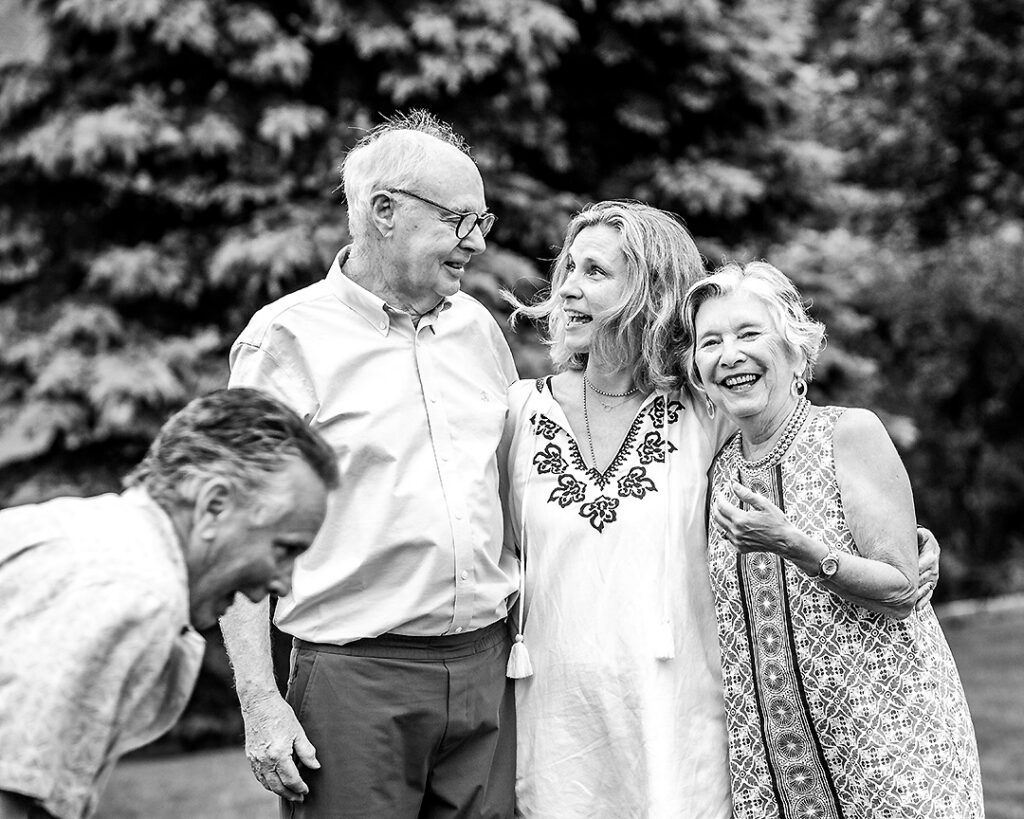 Extended family laughing and acting silly together during outdoor family photo session near Collingwood Ontario