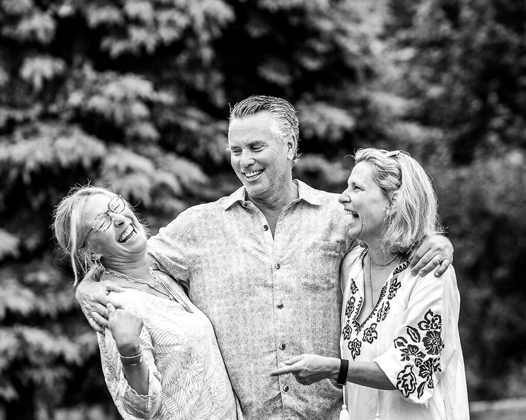 Extended family laughing together during outdoor family photo session near Collingwood Ontario